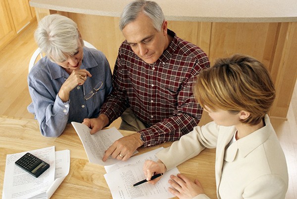 Attorney meeting with older couple
